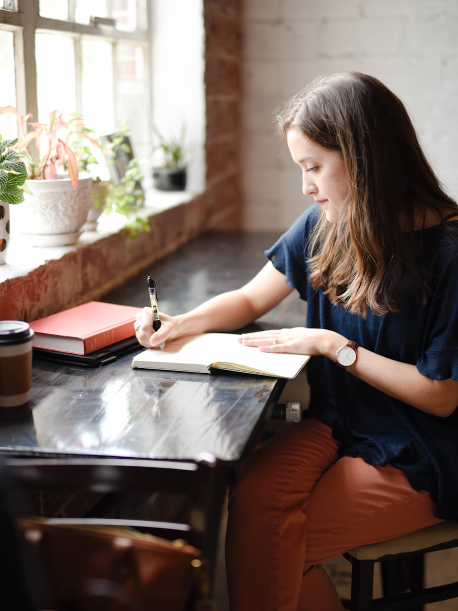 A student writing and working through her notes